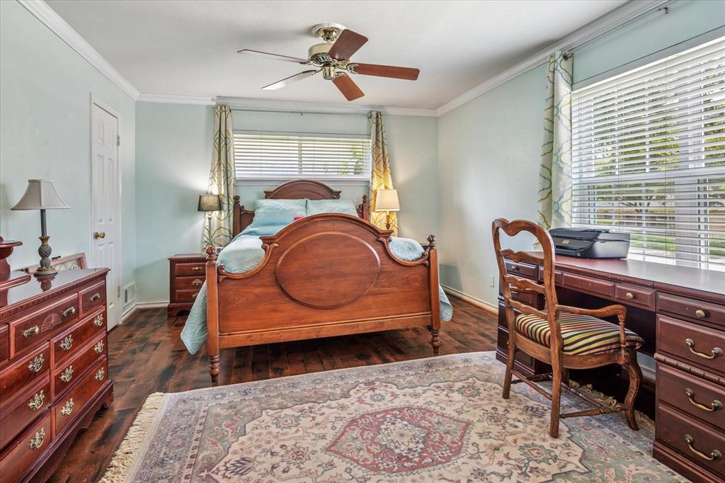 13429 Spring Grove Avenue Dallas, TX 75240 - Photo 12 of 25 a bedroom with furniture and a window