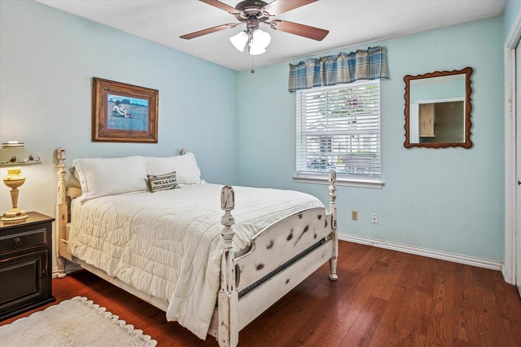 13429 Spring Grove Avenue Dallas, TX 75240 - Photo 18 of 25 a bedroom with a bed and a window