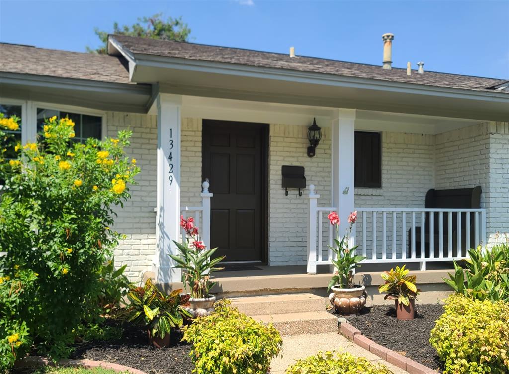 13429 Spring Grove Avenue Dallas, TX 75240 - Photo 2 of 25 a view of a house with potted plants and a bench