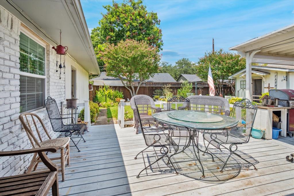 13429 Spring Grove Avenue Dallas, TX 75240 - Photo 22 of 25 a view of a house with backyard and sitting area