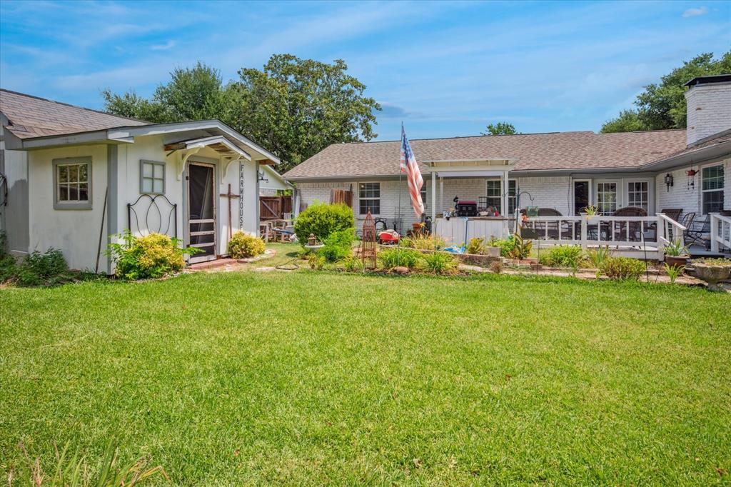13429 Spring Grove Avenue Dallas, TX 75240 - Photo 23 of 25 a front view of a house with garden