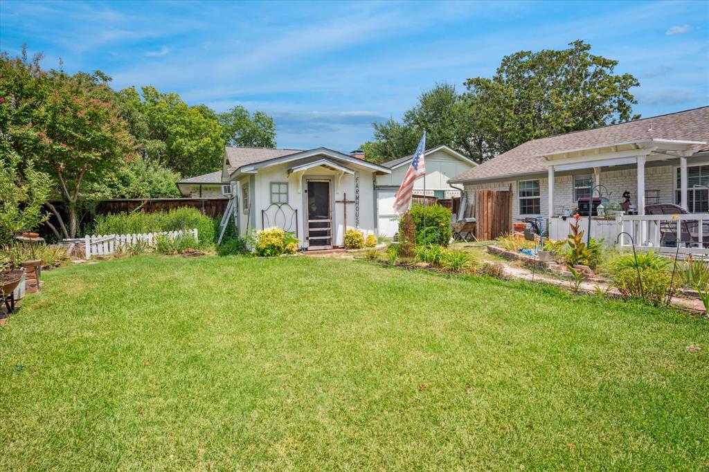 13429 Spring Grove Avenue Dallas, TX 75240 - Photo 24 of 25 a front view of house with yard and green space