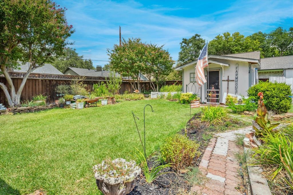 13429 Spring Grove Avenue Dallas, TX 75240 - Photo 25 of 25 a front view of a house with garden