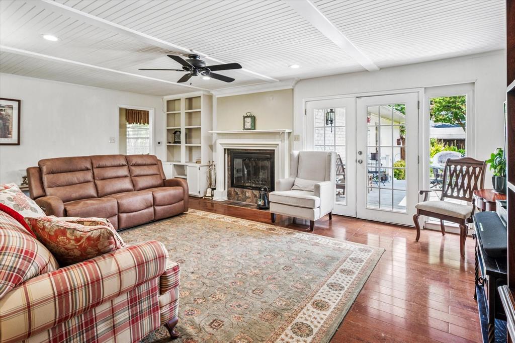 13429 Spring Grove Avenue Dallas, TX 75240 - Photo 3 of 25 a living room with furniture fireplace and a rug
