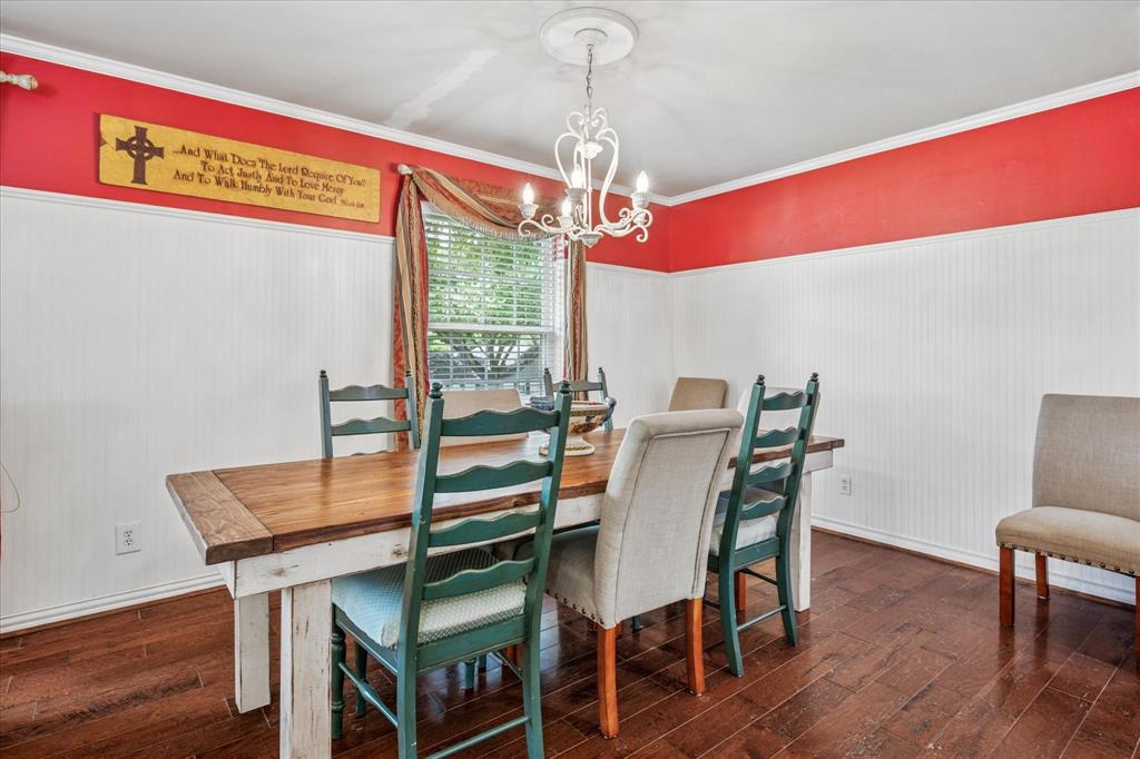 13429 Spring Grove Avenue Dallas, TX 75240 - Photo 6 of 25 a view of a dining room with furniture window and wooden floor