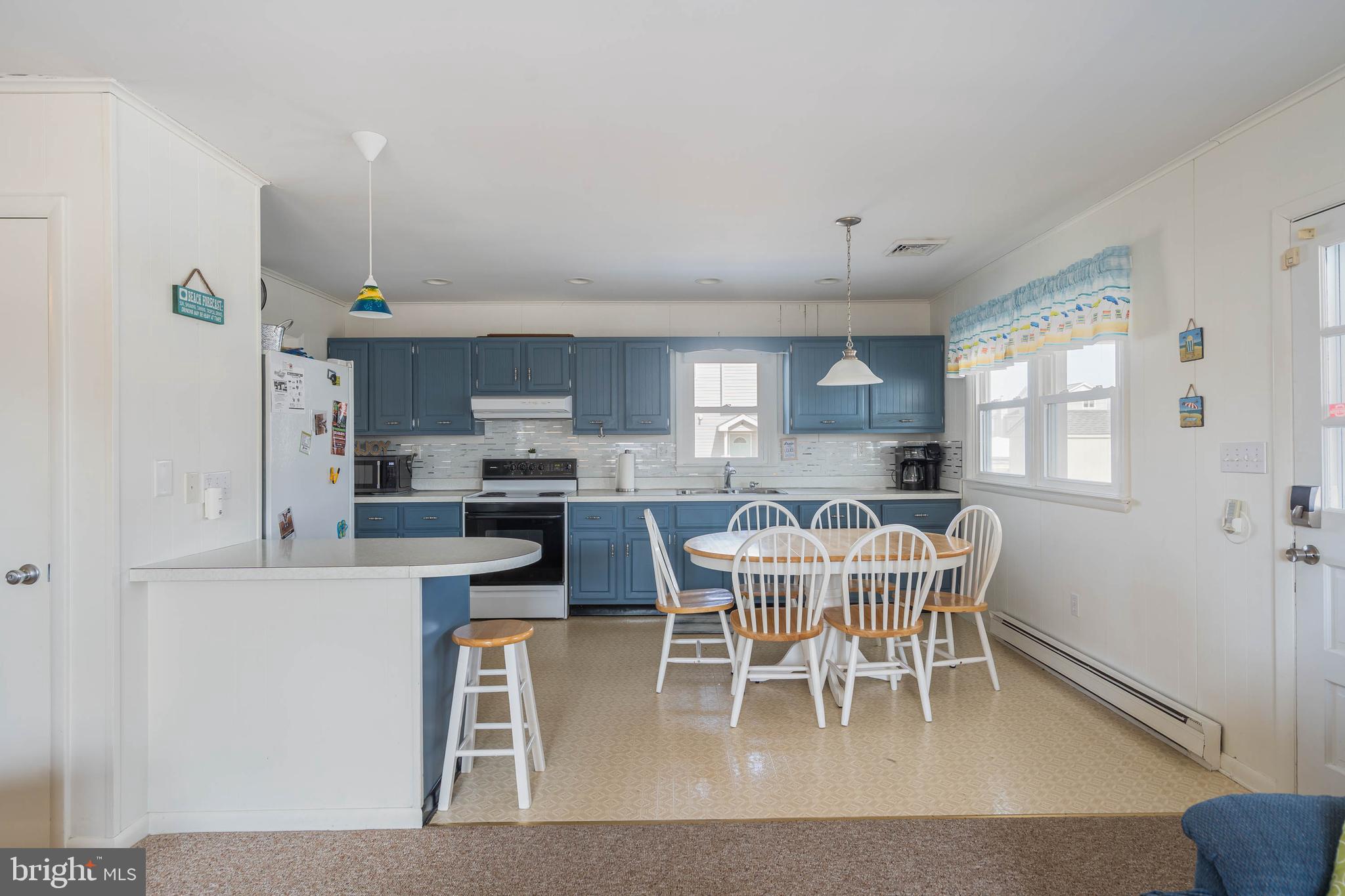 30200 Kent Road Dagsboro, DE 19939 - Photo 11 of 48 a view of a dining room with furniture and wooden floor