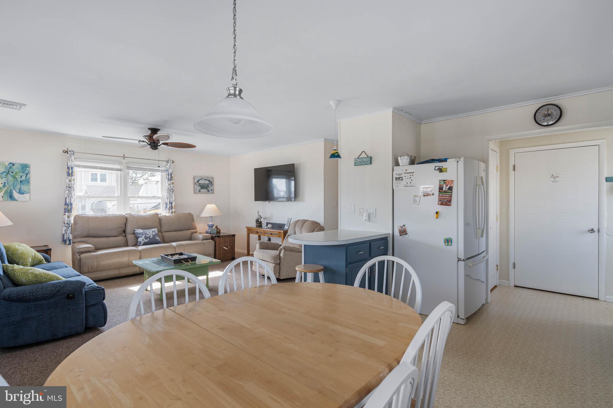 30200 Kent Road Dagsboro, DE 19939 - Photo 12 of 48 a living room with furniture a rug and white walls