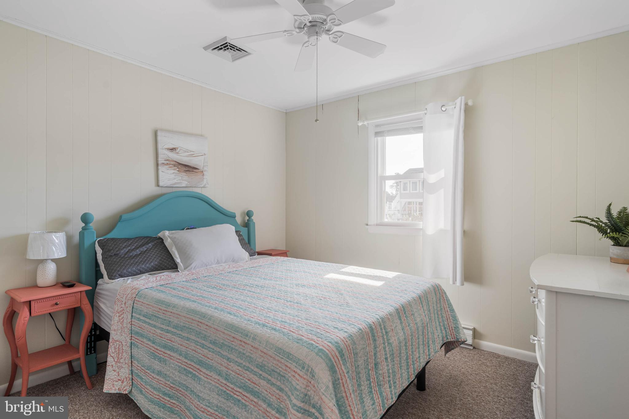 30200 Kent Road Dagsboro, DE 19939 - Photo 21 of 48 a bedroom with a bed and a chandelier