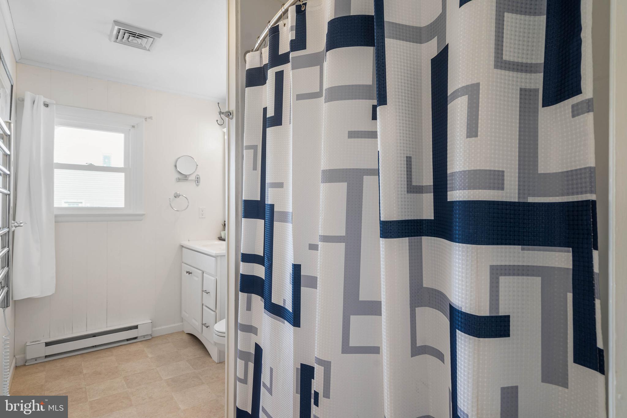 30200 Kent Road Dagsboro, DE 19939 - Photo 22 of 48 a bathroom with a bathtub and shower