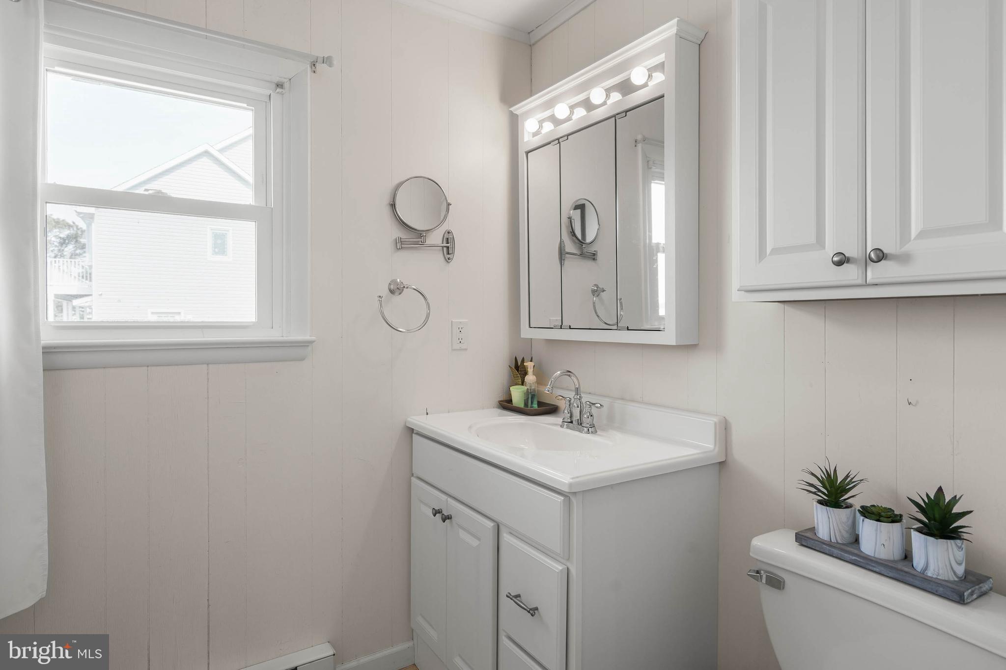 30200 Kent Road Dagsboro, DE 19939 - Photo 23 of 48 a bathroom with a sink vanity granite and a mirror