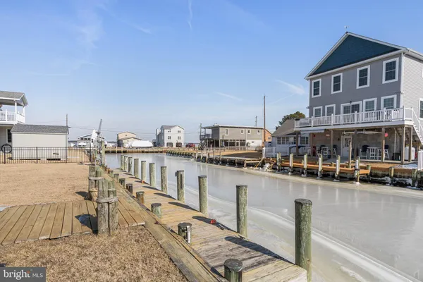 a view of a house with wooden deck