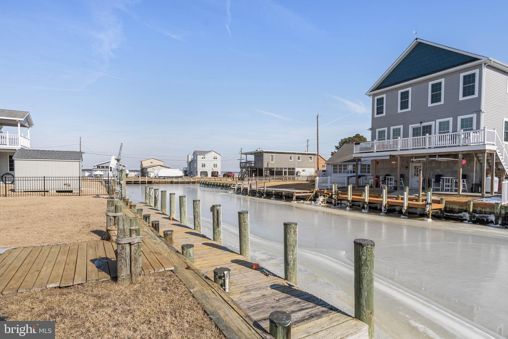 30200 Kent Road Dagsboro, DE 19939 - Photo 5 of 48 a view of a swimming pool with outdoor seating