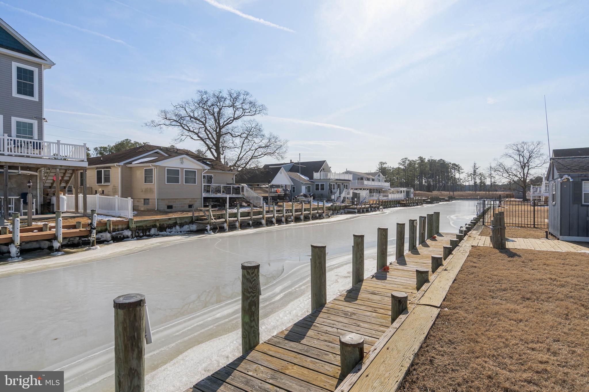 30200 Kent Road Dagsboro, DE 19939 - Photo 7 of 48 a view of a house with wooden deck