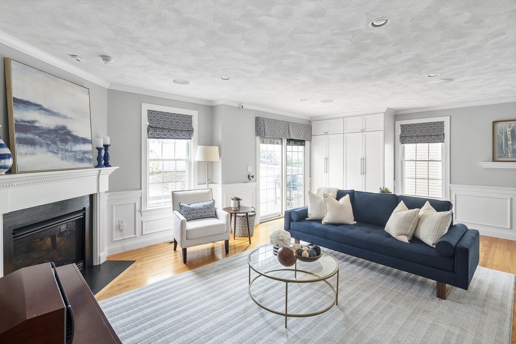 102 4th Street, Unit 2 Medford, MA 02155 - Photo 1 of 17 a living room with furniture and a fireplace