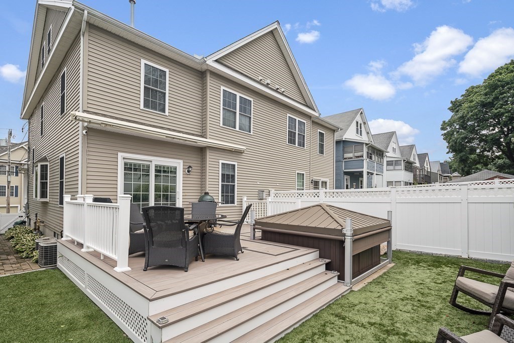 102 4th Street, Unit 2 Medford, MA 02155 - Photo 16 of 17 a view of a patio with couches chairs and potted plants