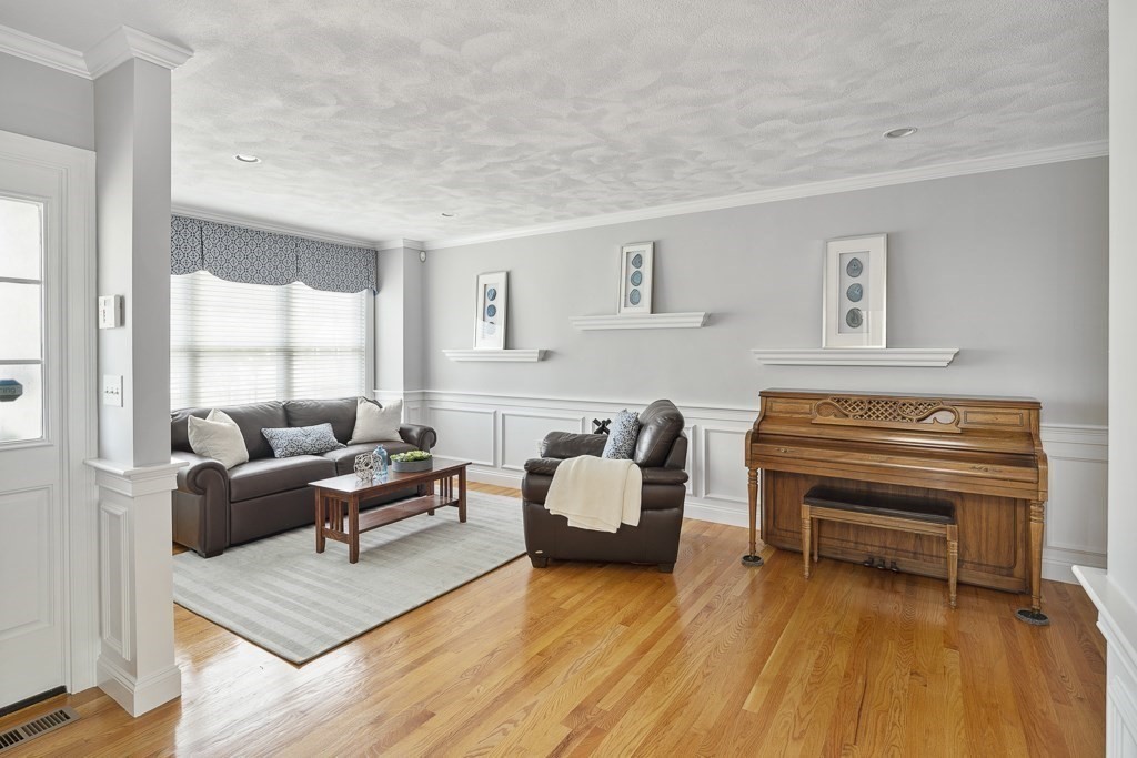 102 4th Street, Unit 2 Medford, MA 02155 - Photo 6 of 17 a living room with furniture and a window