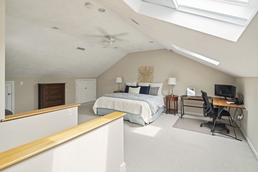 102 4th Street, Unit 2 Medford, MA 02155 - Photo 10 of 17 a bedroom with a bed and a flat screen tv