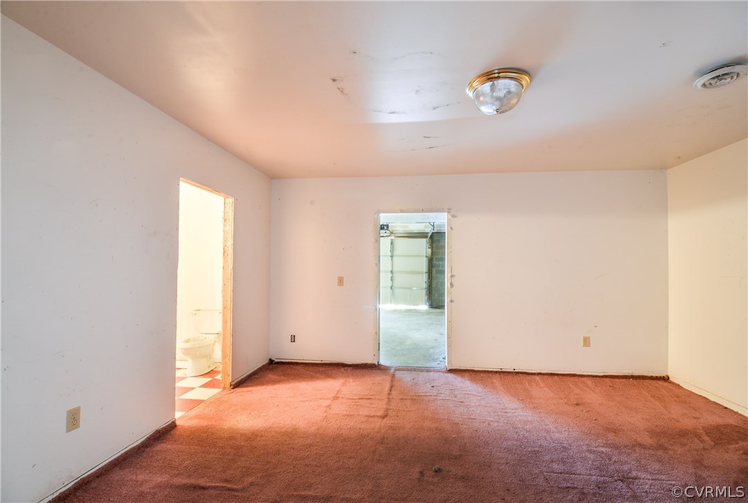 708 Buckner Road Bumpass, VA 23024 - Photo 11 of 40 an empty room with a window