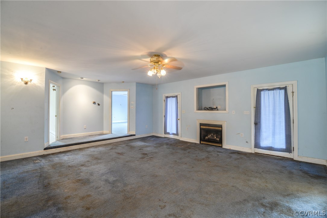 708 Buckner Road Bumpass, VA 23024 - Photo 12 of 40 a view of an empty room with a fireplace