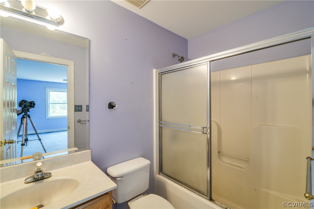708 Buckner Road Bumpass, VA 23024 - Photo 19 of 40 a bathroom with a sink toilet and shower