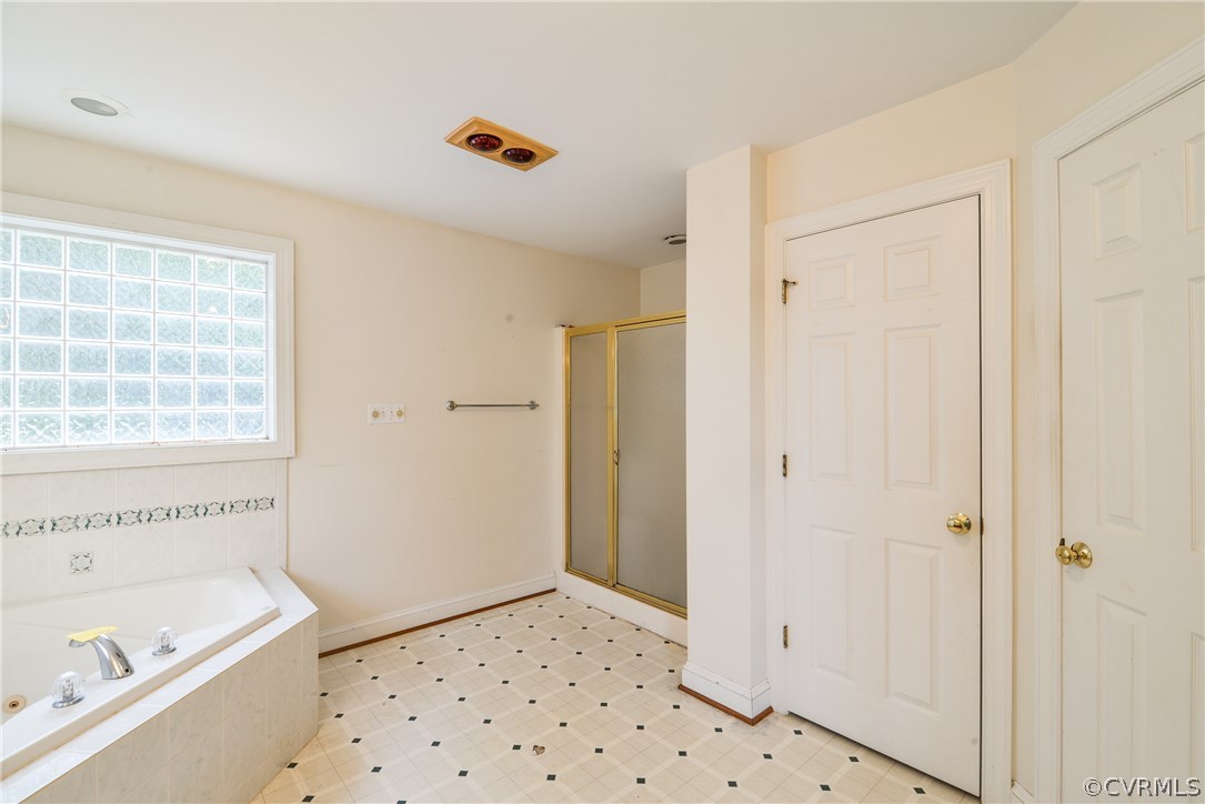 708 Buckner Road Bumpass, VA 23024 - Photo 28 of 40 a bathroom with a bathtub sink and toilet