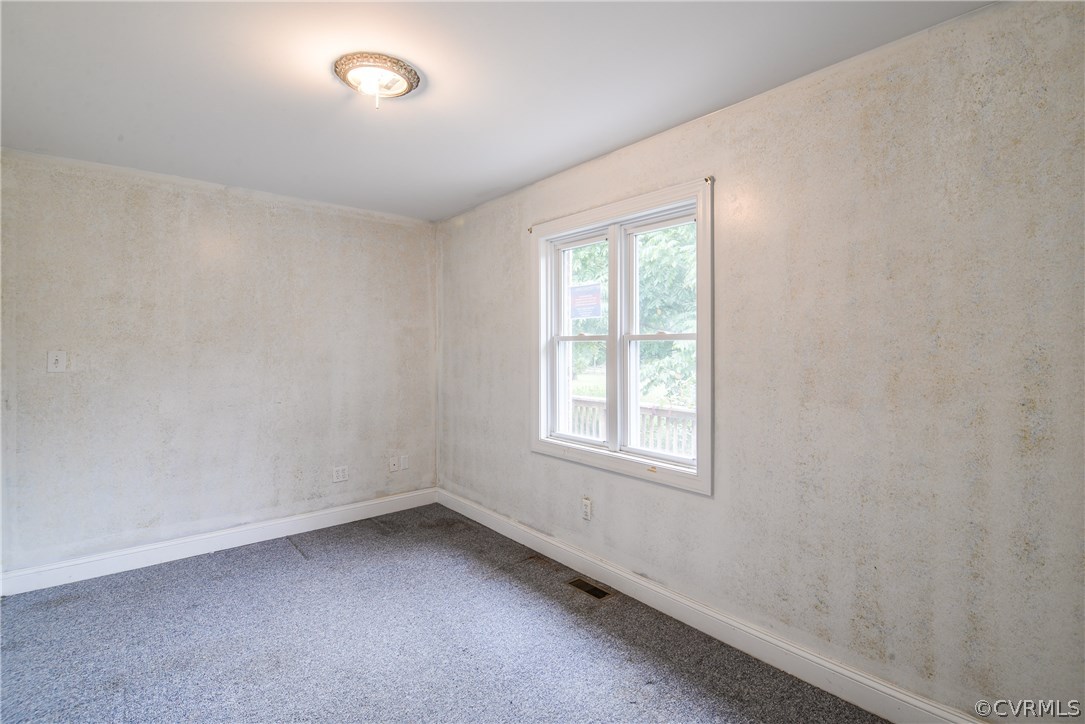708 Buckner Road Bumpass, VA 23024 - Photo 7 of 40 an empty room with a window
