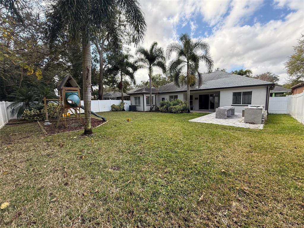 1146 Lumsden Trace Circle Valrico, FL 33594 - Photo 17 of 19 a front view of house with yard having outdoor seating