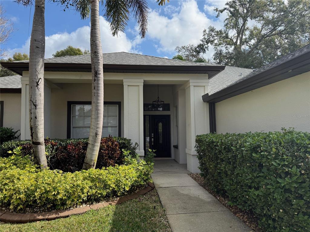 1146 Lumsden Trace Circle Valrico, FL 33594 - Photo 2 of 19 a front view of a house with a yard