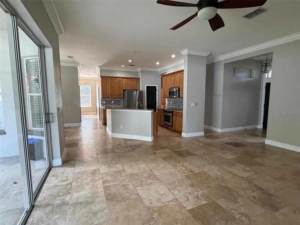 1146 Lumsden Trace Circle Valrico, FL 33594 - Photo 5 of 19 a view of a hallway with stainless steel appliances granite countertop cabinets and a floor to ceiling window