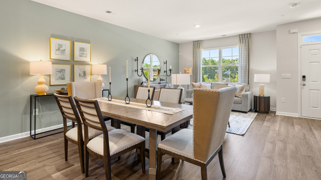 420 Reflection Drive Stockbridge, GA 30281 - Photo 25 of 58 a view of a dining room with furniture and wooden floor