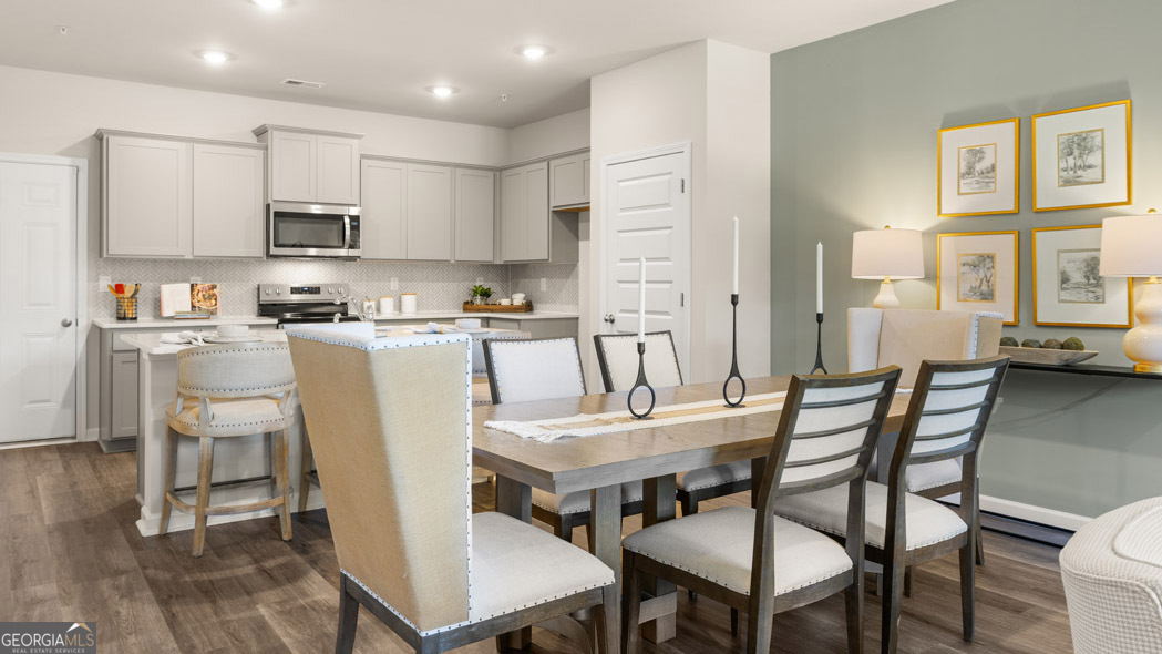 420 Reflection Drive Stockbridge, GA 30281 - Photo 26 of 58 a view of a dining room with furniture and wooden floor