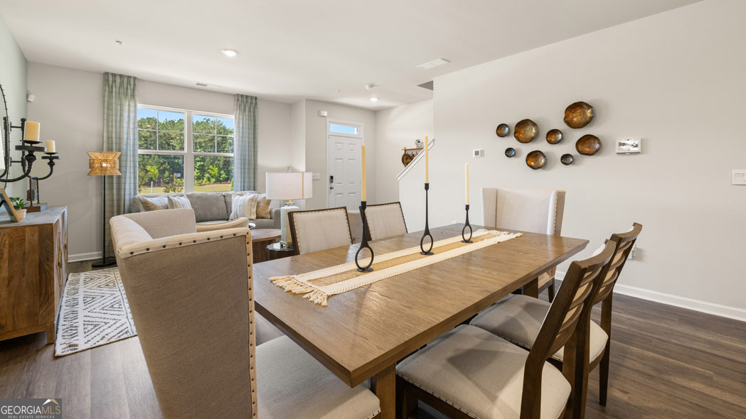 420 Reflection Drive Stockbridge, GA 30281 - Photo 27 of 58 a dining room with furniture and wooden floor