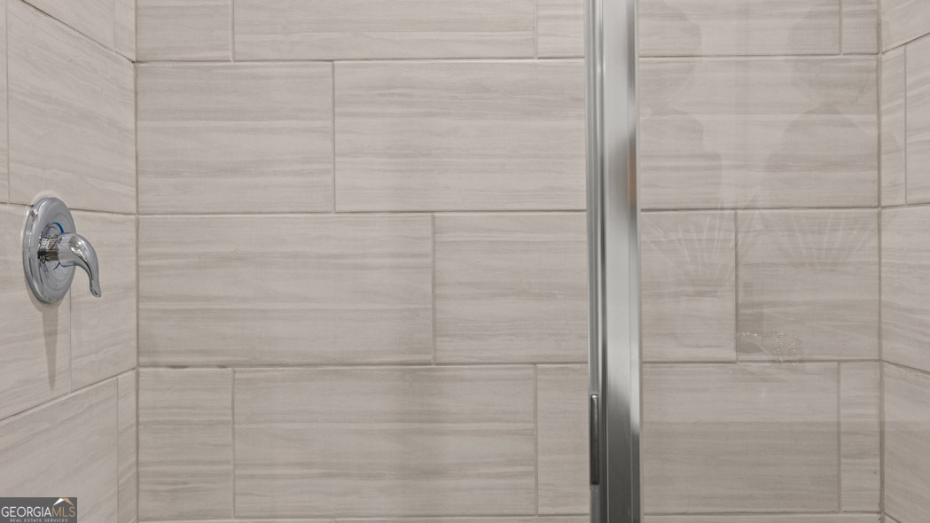 420 Reflection Drive Stockbridge, GA 30281 - Photo 43 of 58 a bathroom with a shower