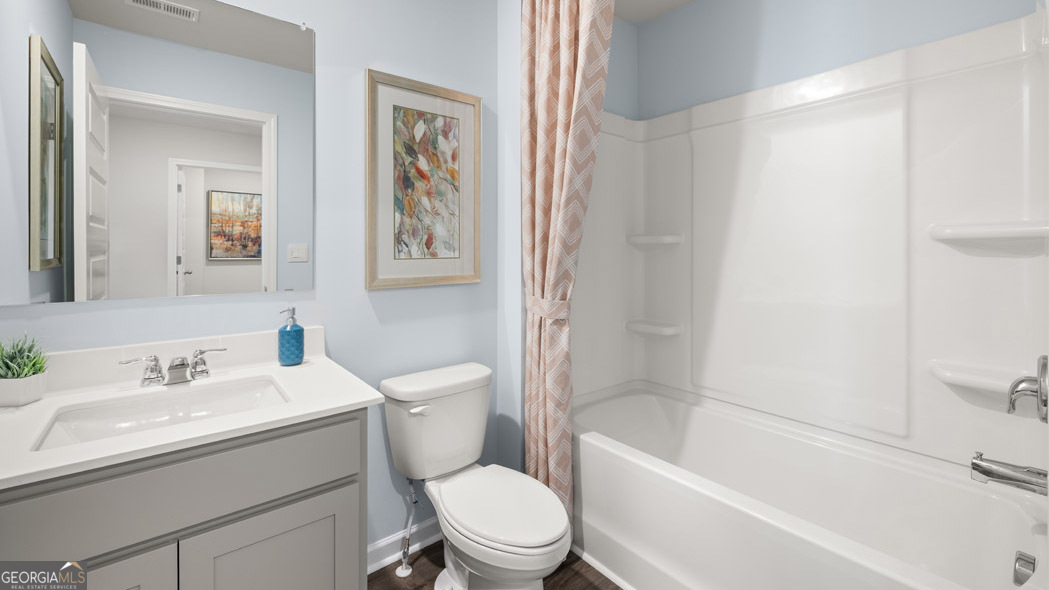 420 Reflection Drive Stockbridge, GA 30281 - Photo 58 of 58 a bathroom with a sink toilet and a bathtub
