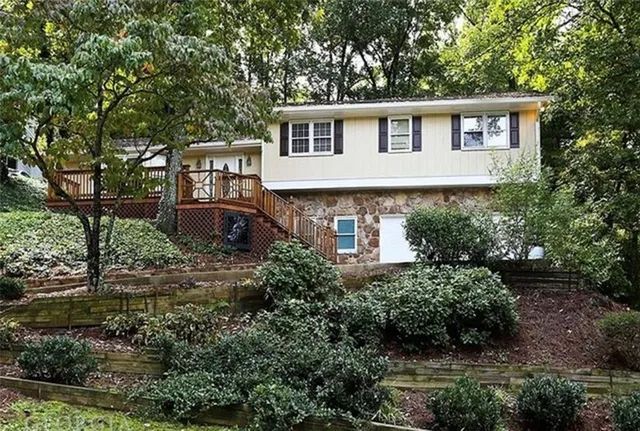 a front view of a house with garden