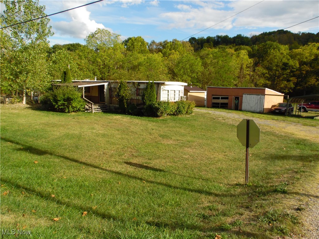 19559 Salt Run Road Caldwell, OH 43724 - Photo 2 of 8 View of front of home with a front yard and an outdoor structure