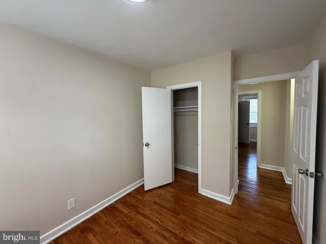 a view of front door with wooden floor