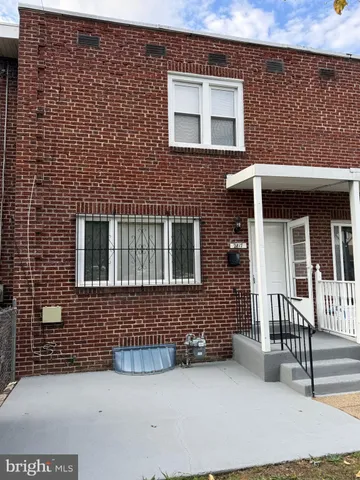 a brick house with a large windows