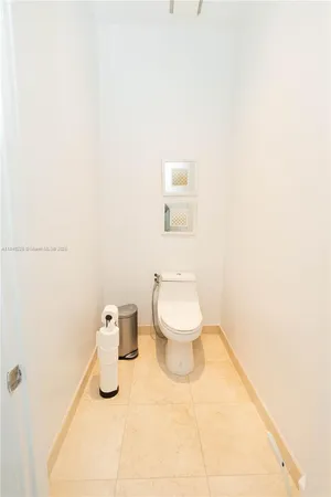a bathroom with a toilet and a sink