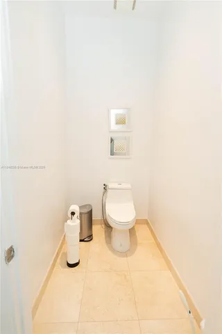 a bathroom with a toilet and a sink