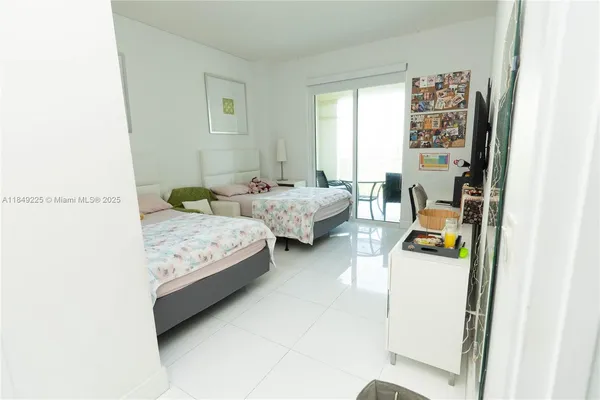 a bedroom with bed and a window