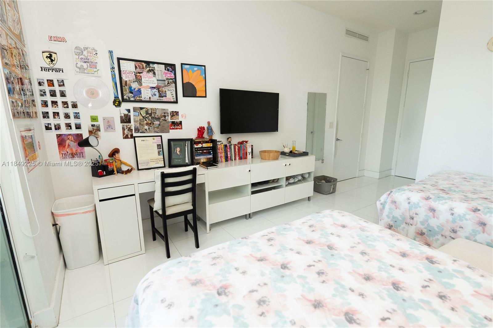 150 Sunny Isles Boulevard, Unit 1TH403 Sunny Isles Beach, FL 33160 - Photo 20 of 34 a bedroom with a bed and a flat screen tv