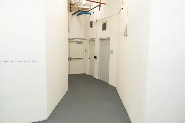 a view of a room with a hallway