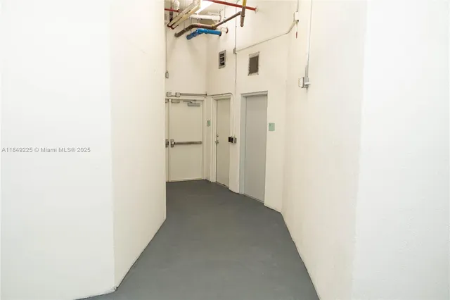 a view of a room with a hallway