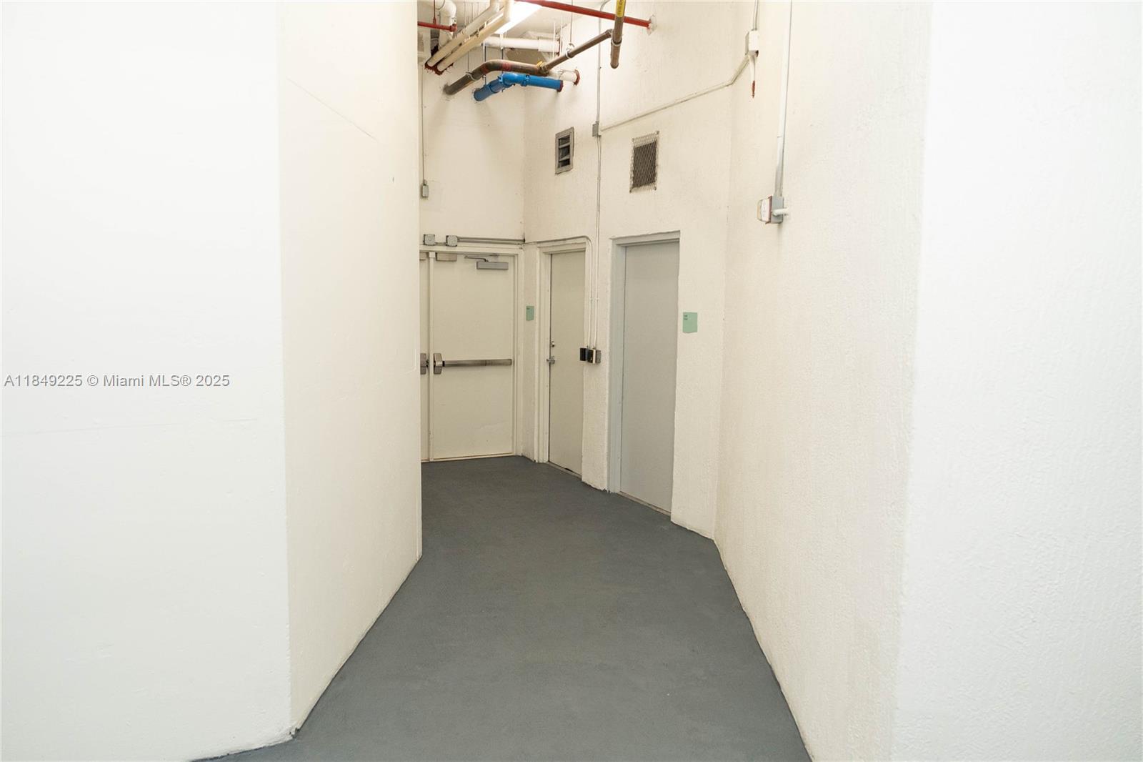 150 Sunny Isles Boulevard, Unit 1TH403 Sunny Isles Beach, FL 33160 - Photo 2 of 34 a view of a room with a hallway