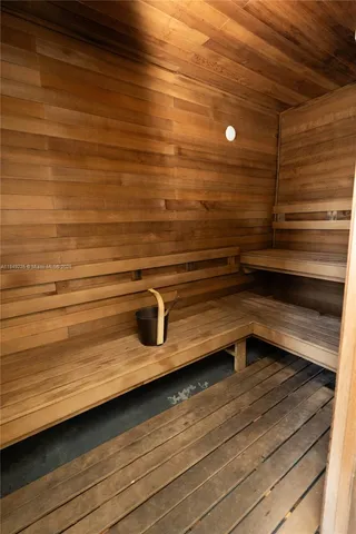 a view of the patio with dining table and chairs potted plants