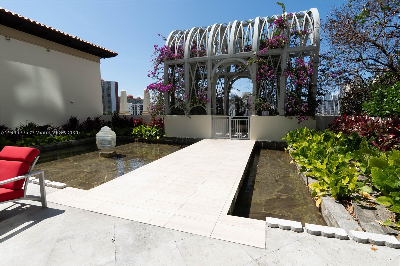 150 Sunny Isles Boulevard, Unit 1TH403 Sunny Isles Beach, FL 33160 - Photo 31 of 34 a view of group of people in a patio