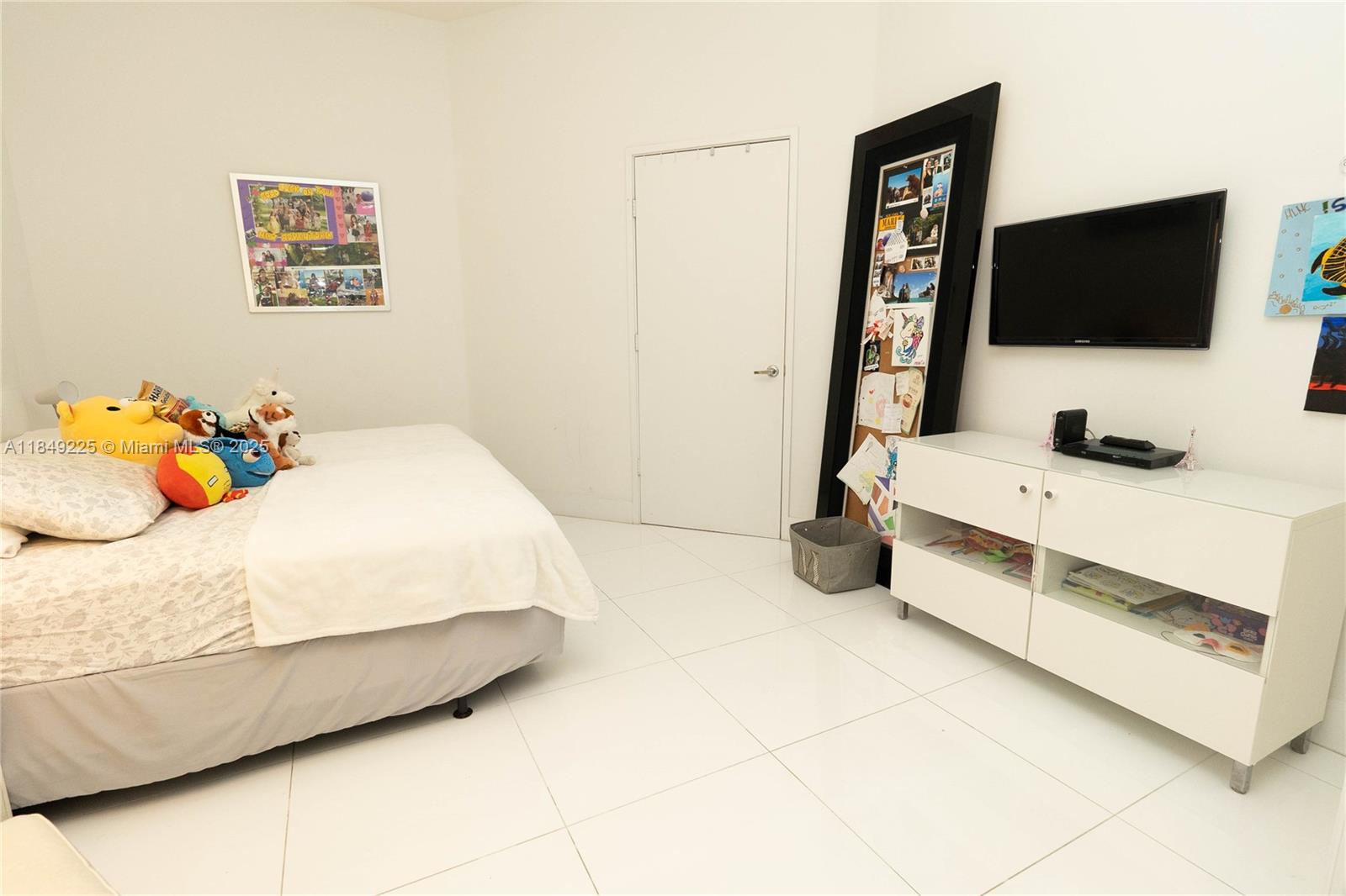 150 Sunny Isles Boulevard, Unit 1TH403 Sunny Isles Beach, FL 33160 - Photo 9 of 34 a bedroom with a bed and flat screen tv