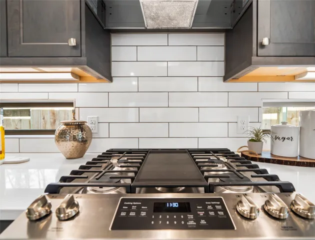 a stove sitting inside of a kitchen with a stove