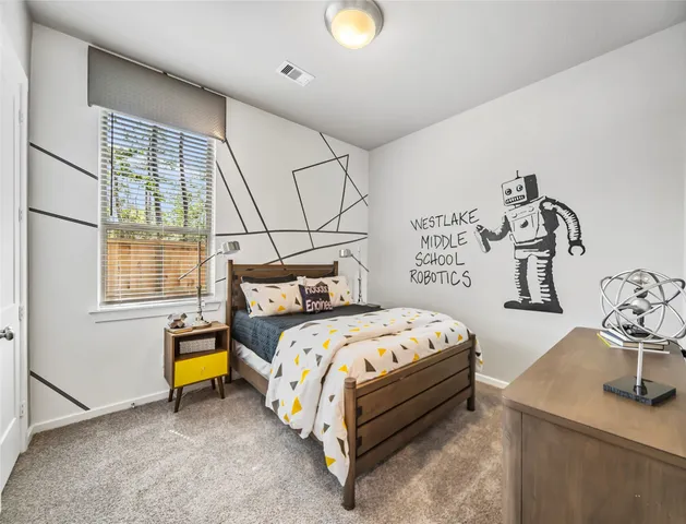 a bed room with a bed and a window